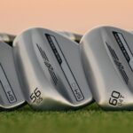 Golf wedges aligned by loft degree for distance control.