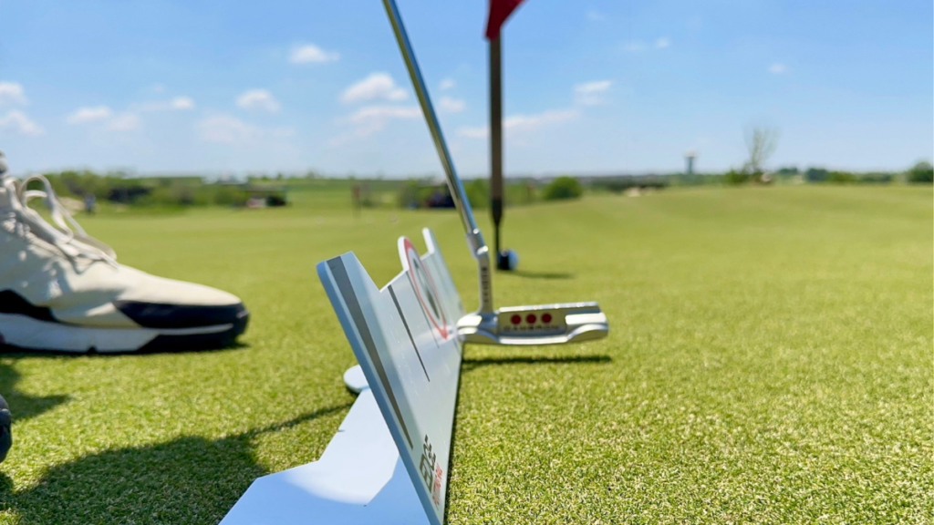 Golf putting distance control drill using Edge Putting Rail designed to train consistent start line and pace on the greens.