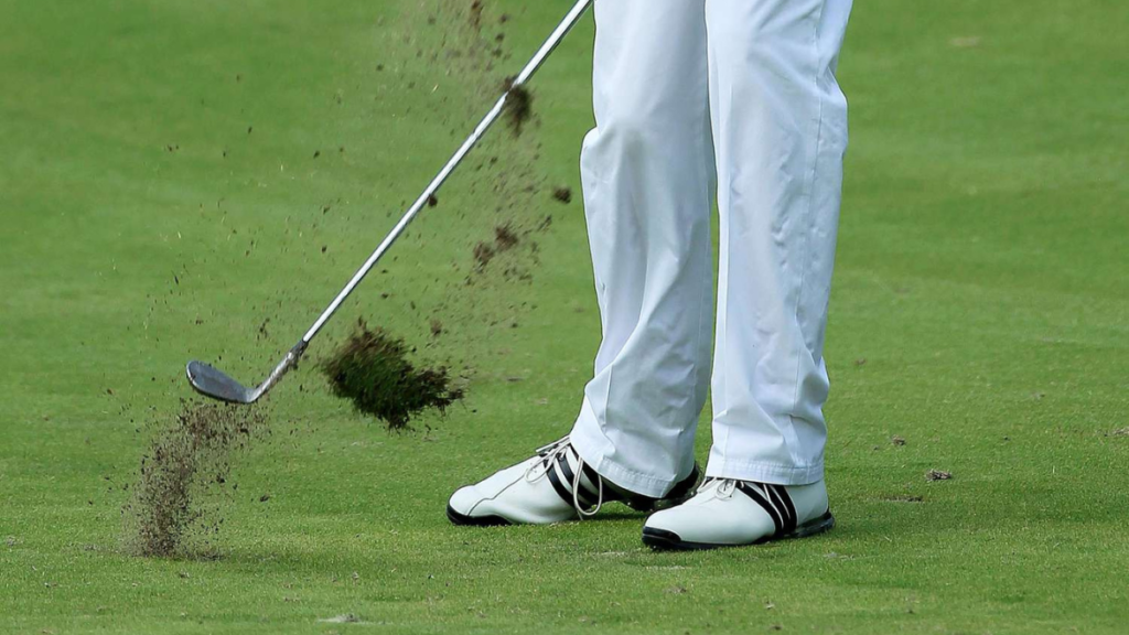 Golfer performing smooth wedge swing focused on feel not mechanics