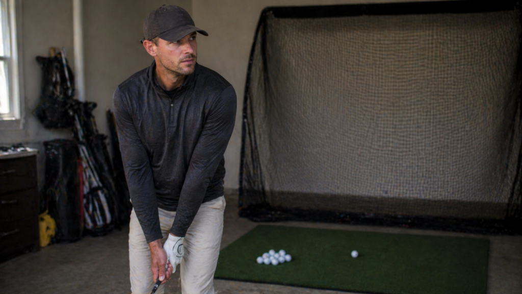 Golfer building a clear target image before starting a wedge pre-shot routine.