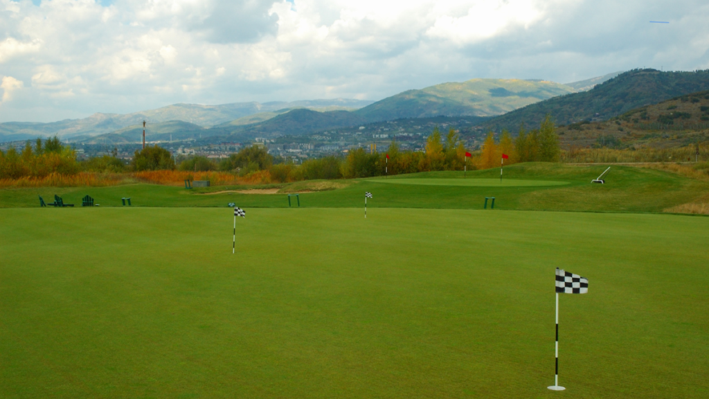 Practicing putting distance control by changing targets and distances each attempt.