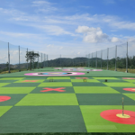 Wedge distance control training setup with multiple landing zones at different yardages.