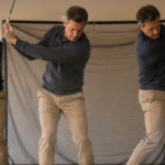Golfer practicing wedge swing speed control at home by changing the height and energy of the finish.
