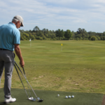 Experienced golfer on a range with three clearly separated wedge targets, changing clubs or yardage between balls.